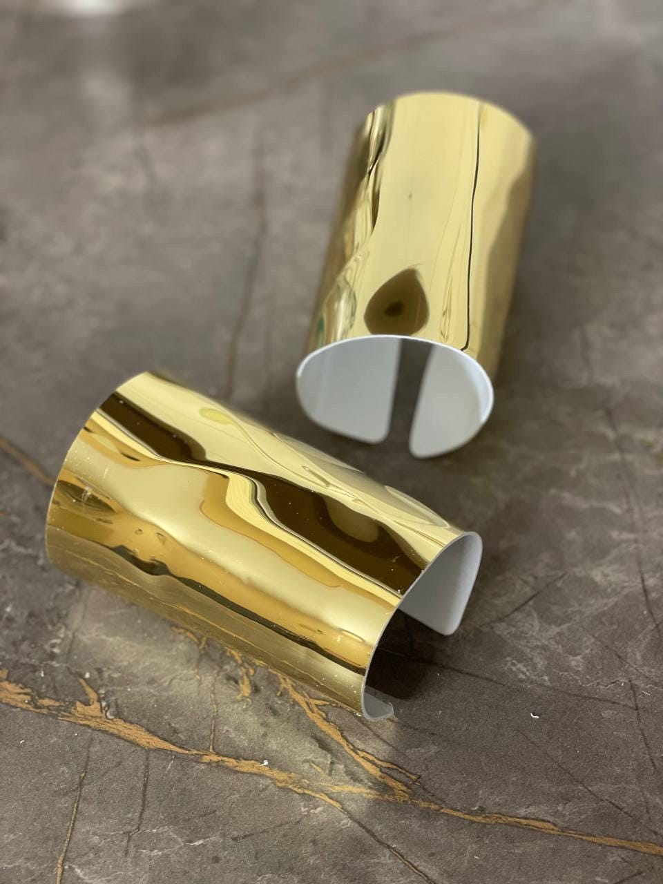 Golden or silver bracelets (2 pieces), statement cuffs, liquid gold accessories