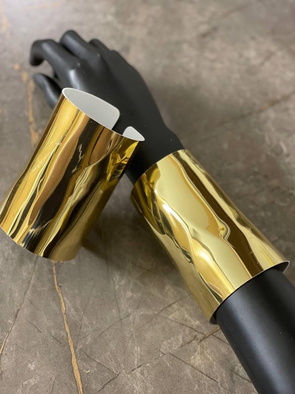 Golden or silver bracelets (2 pieces), statement cuffs, liquid gold accessories